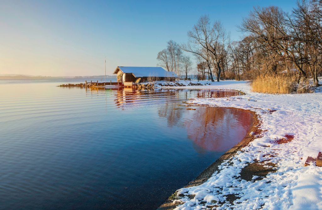 Snowy landscape and still rural lake